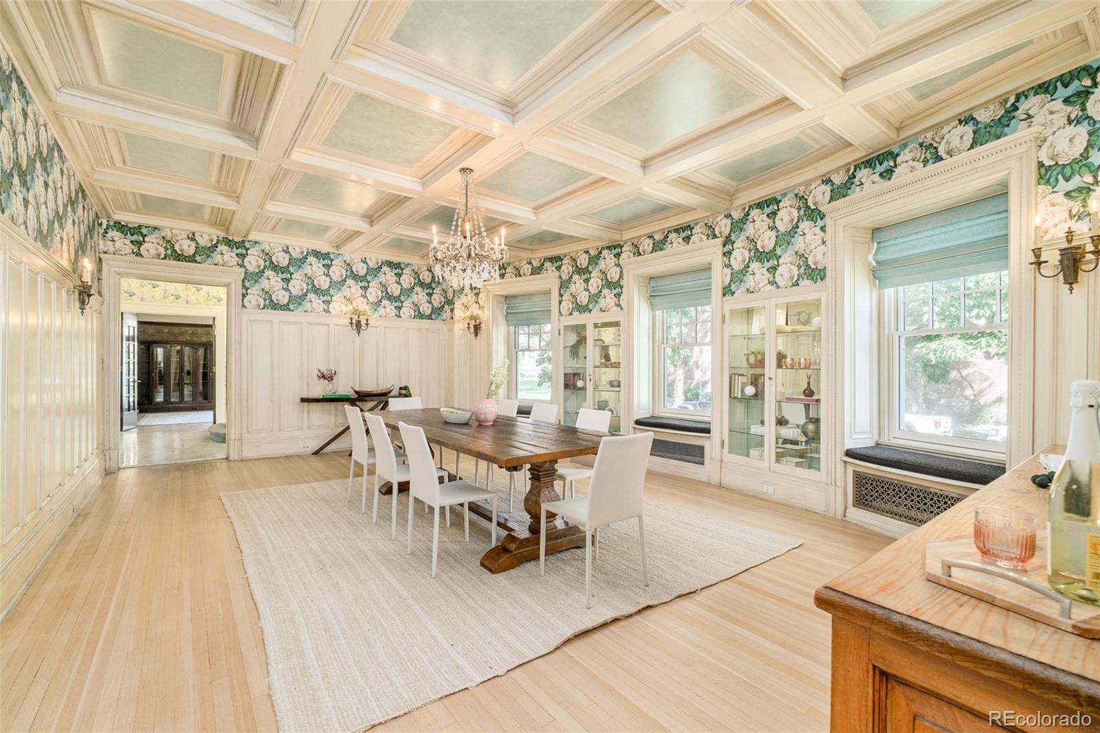 680 North Clarkson Street Denver, CO 80218 - Photo 15 of 39 a dining room with wooden floor a chandelier a wooden table and chairs