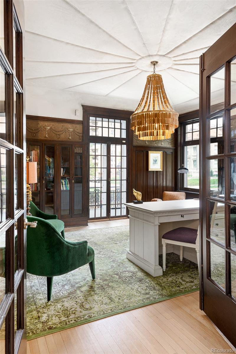 680 North Clarkson Street Denver, CO 80218 - Photo 19 of 39 a view of living room kitchen with stainless steel appliances granite countertop sink and stove top oven