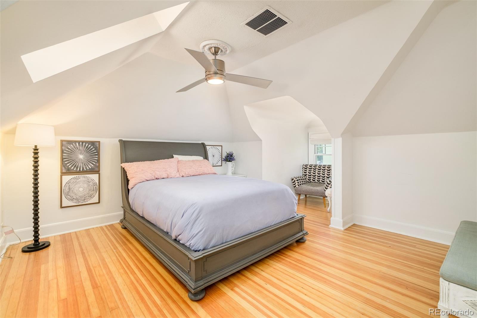 680 North Clarkson Street Denver, CO 80218 - Photo 31 of 39 a bedroom with a bed and wooden floor