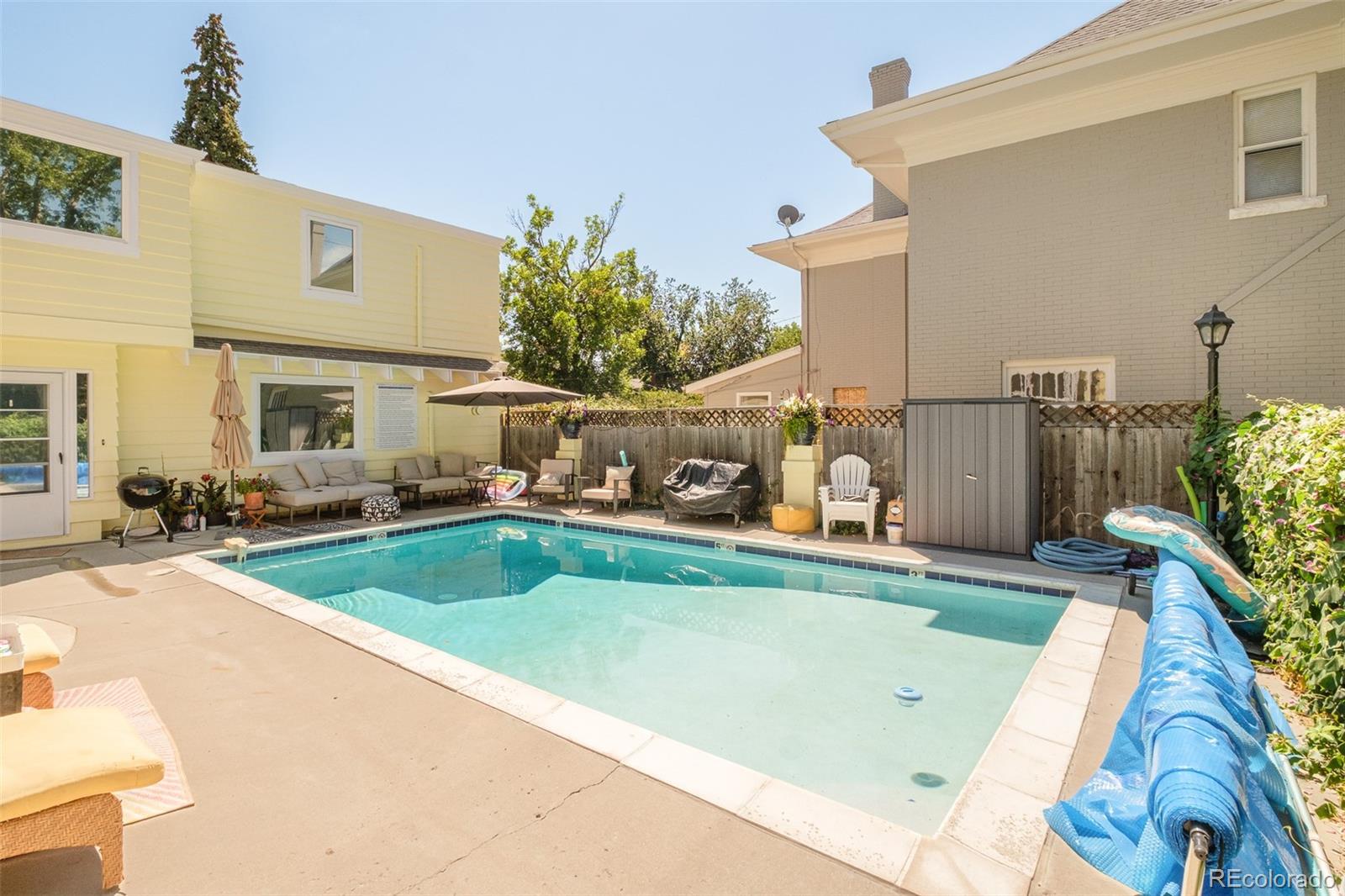 680 North Clarkson Street Denver, CO 80218 - Photo 34 of 39 a view of a swimming pool with a patio