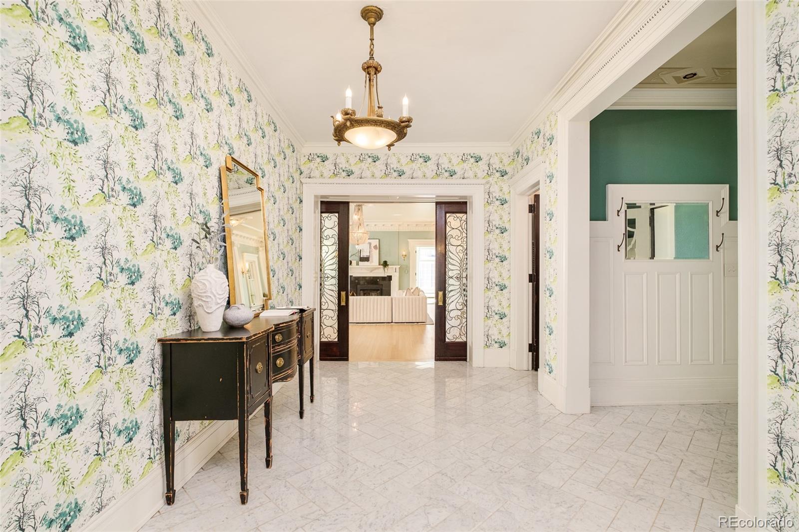 680 North Clarkson Street Denver, CO 80218 - Photo 5 of 39 a view of a dining room with furniture and chandelier