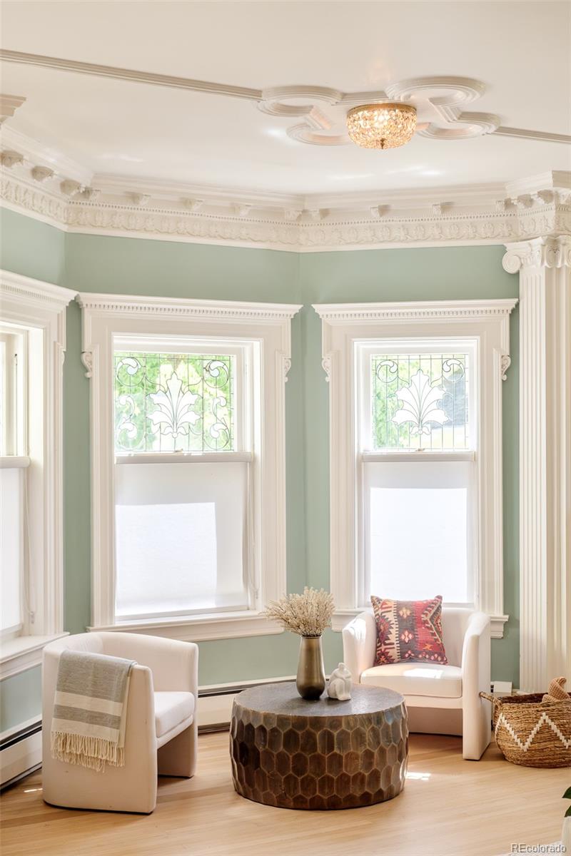 680 North Clarkson Street Denver, CO 80218 - Photo 6 of 39 a living room with furniture and a window
