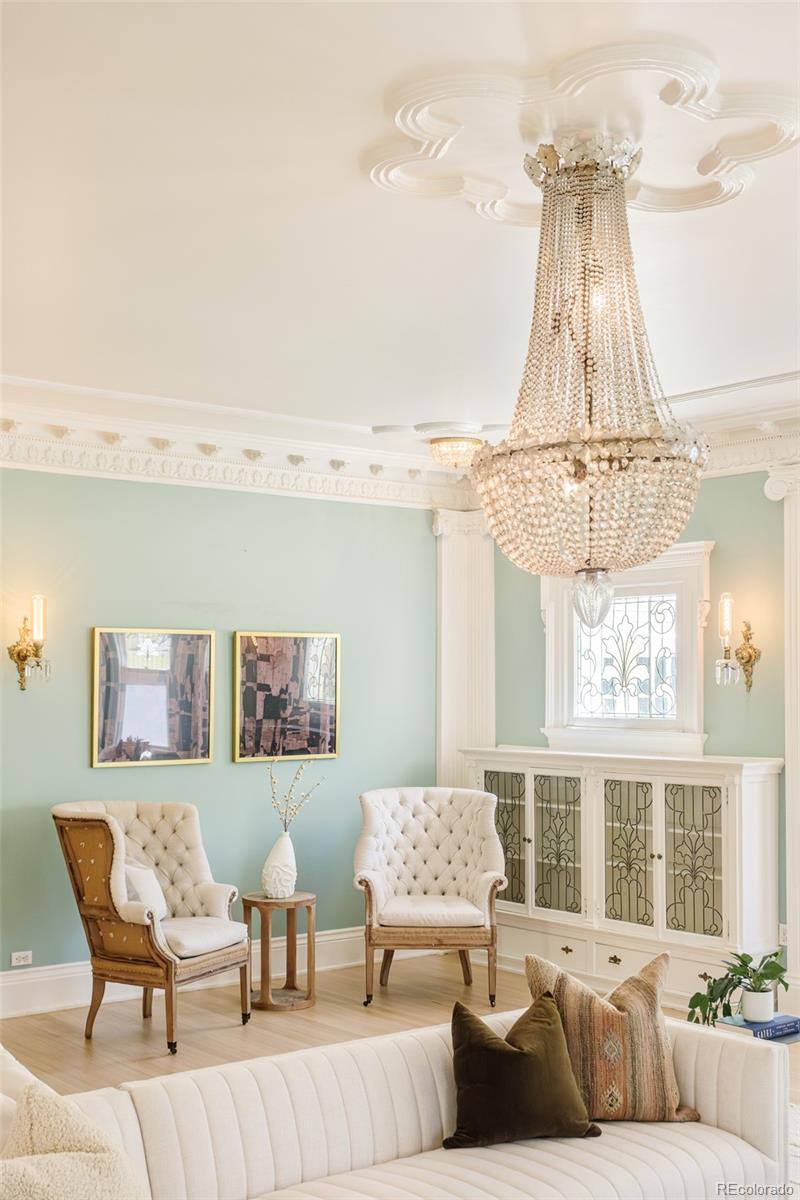 680 North Clarkson Street Denver, CO 80218 - Photo 9 of 39 a living room with furniture and a chandelier