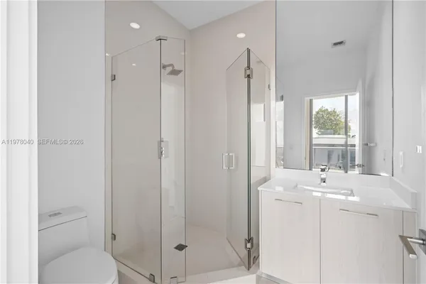 a bathroom with a shower and bathtub