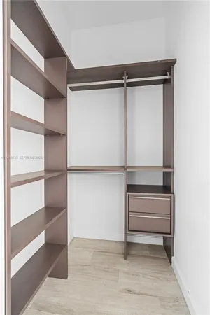 a dining room with furniture and potted plant