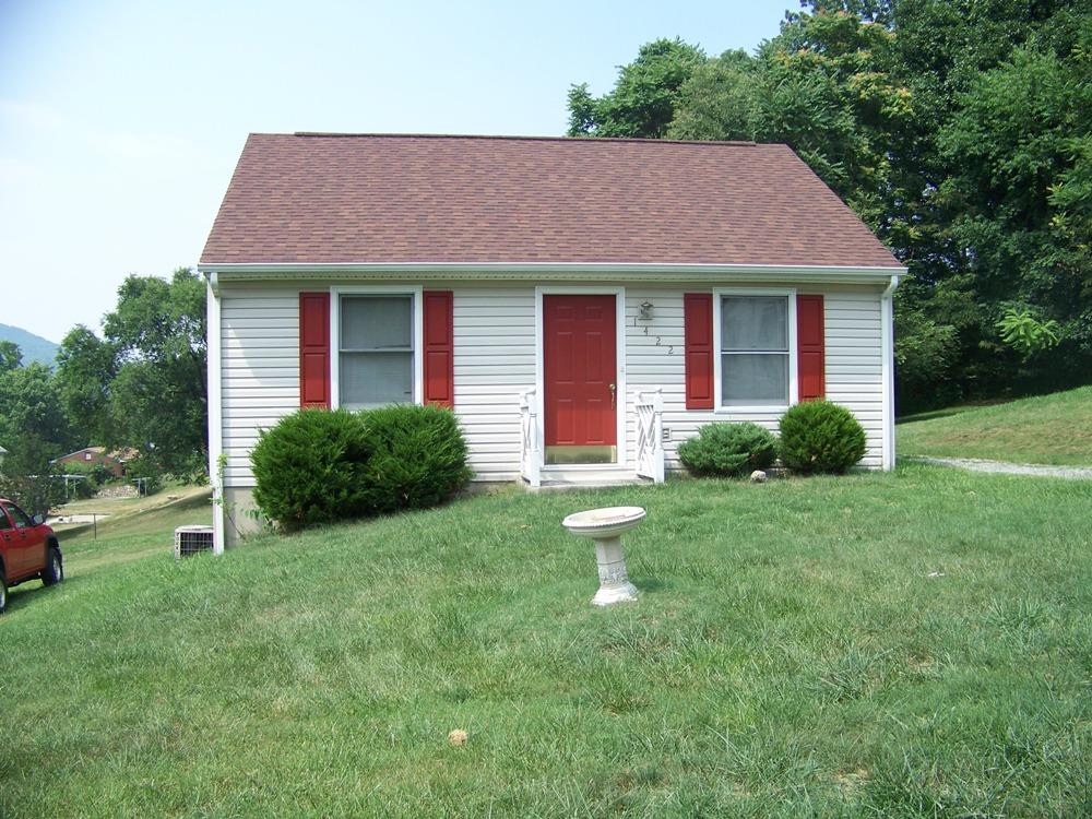 1422 Eanes Road Roanoke, VA 24014 - Photo 1 of 5 a front view of a house with a yard and trees