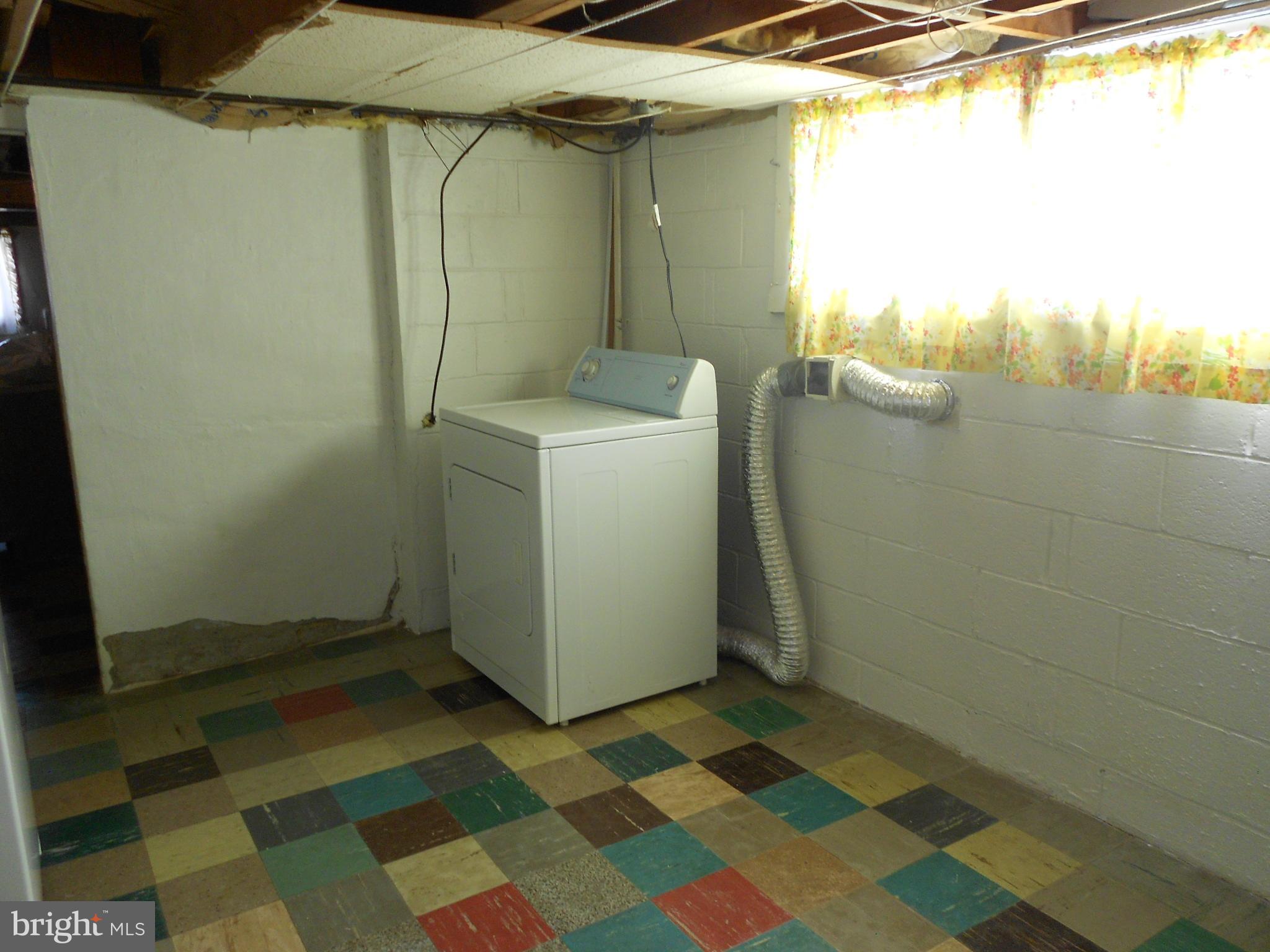 8224 Oakleigh Road Baltimore, MD 21234 - Photo 25 of 26 a bathroom with a sink and a mirror