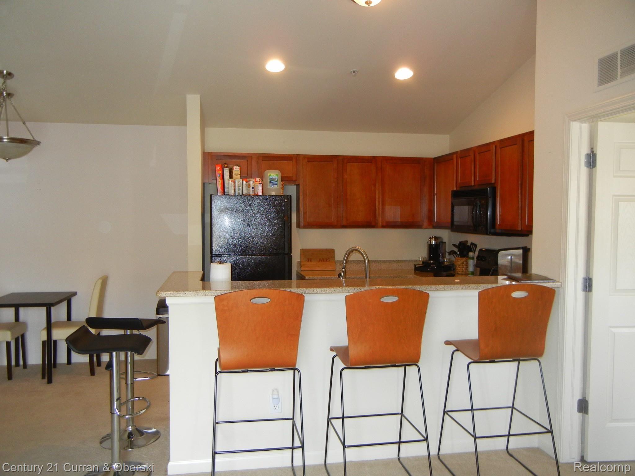 270 North Wixom Road, Unit 60 Wixom, MI 48393 - Photo 10 of 26 Kitchen as seen from Living Room