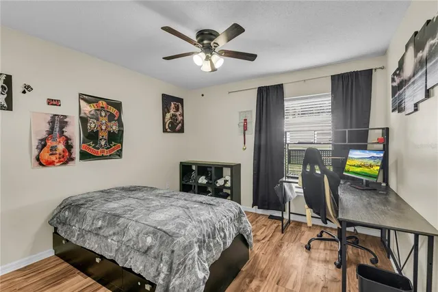 a bedroom that has a bed and a table in it