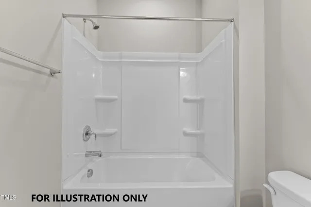 a bathroom with a bath tub with a shower