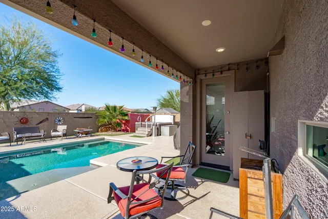 a view of a backyard with sitting area