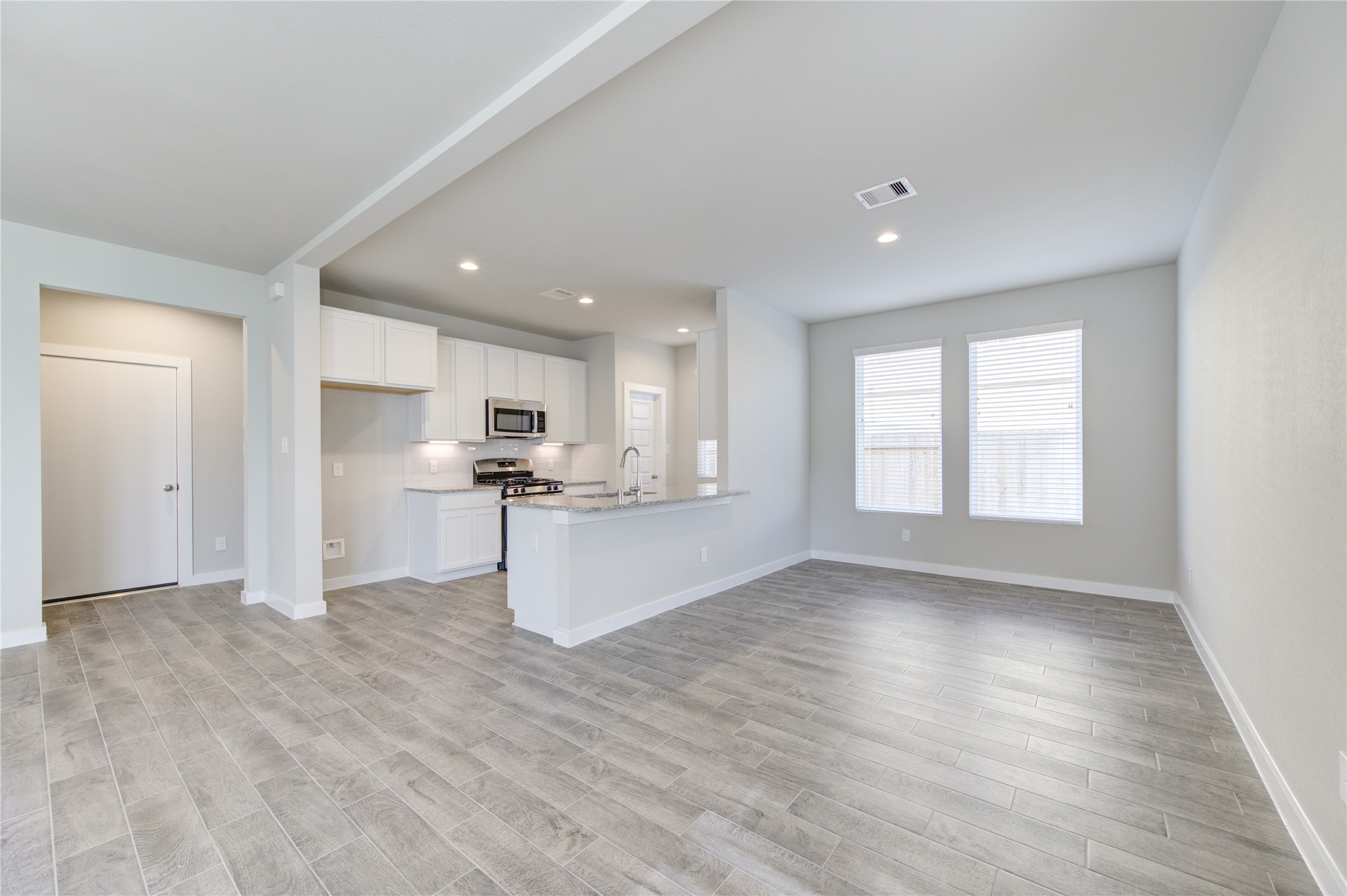 2623 Finley Lane Rosenberg, TX 77471 - Photo 12 of 49 a view of kitchen with wooden floor and large window
