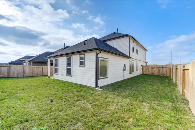 a view of a backyard of the house