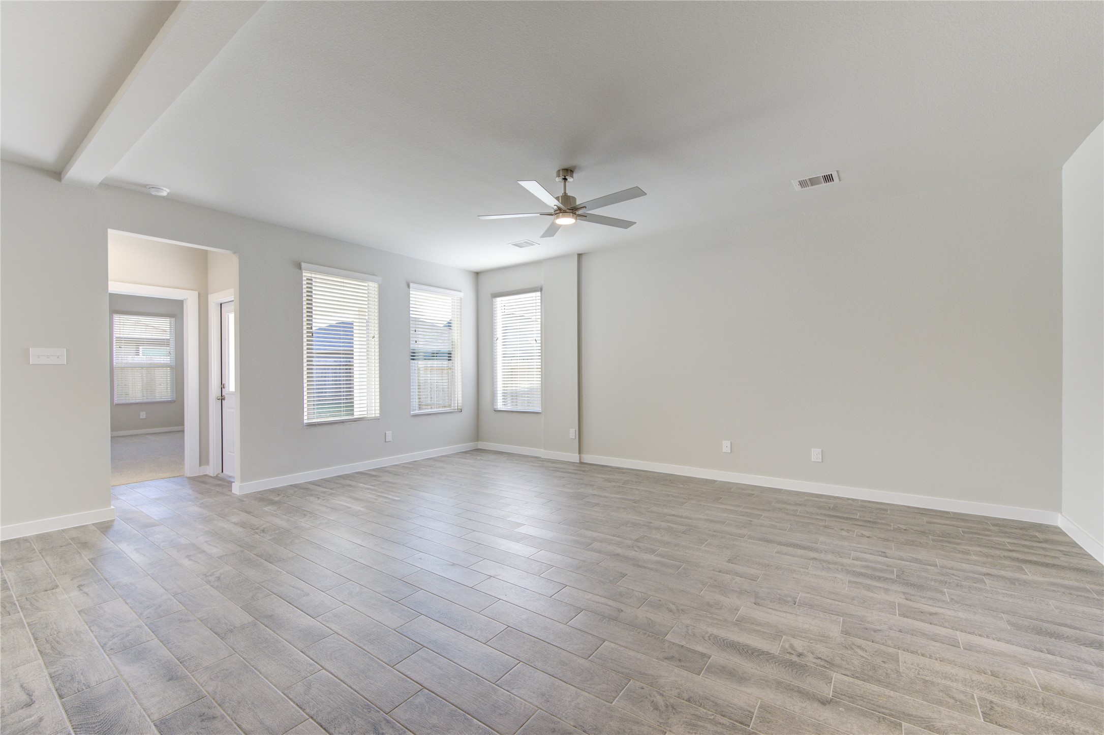 2623 Finley Lane Rosenberg, TX 77471 - Photo 9 of 49 wooden floor in an empty room with a window