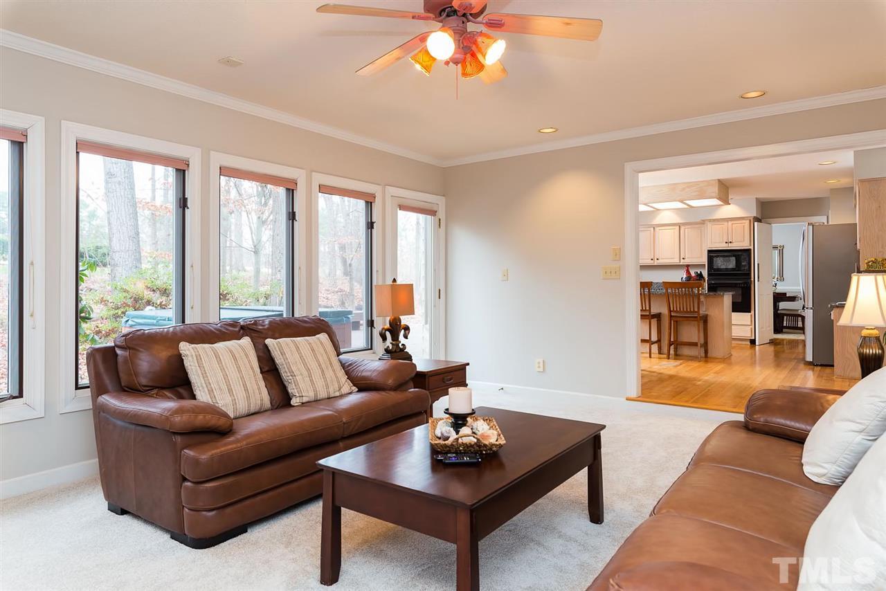 8816 Ross Court Raleigh, NC 27613 - Photo 4 of 25 a living room with furniture and a large window