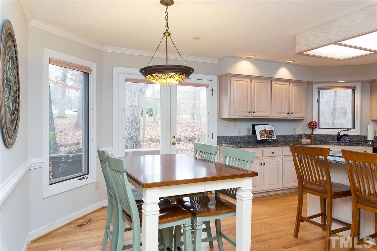 8816 Ross Court Raleigh, NC 27613 - Photo 5 of 25 a view of a dining room with furniture window and outside view
