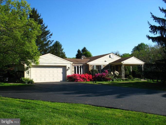 1207 Culvert Road Towson, MD 21286 - Photo 1 of 29 a front view of a house with a garden