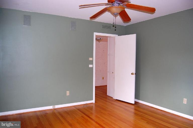 1207 Culvert Road Towson, MD 21286 - Photo 29 of 29 a view of an empty room with wooden floor
