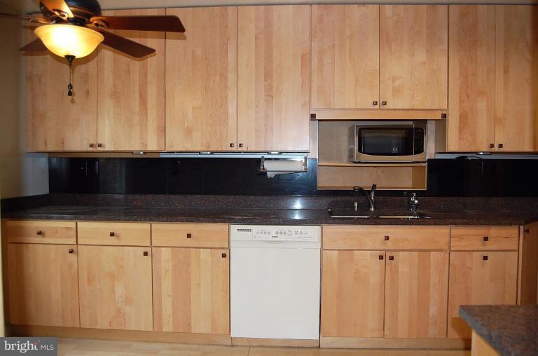 1207 Culvert Road Towson, MD 21286 - Photo 9 of 29 a kitchen with appliances cabinets and a microwave oven