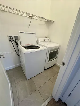 a white sink sitting next to a white sink