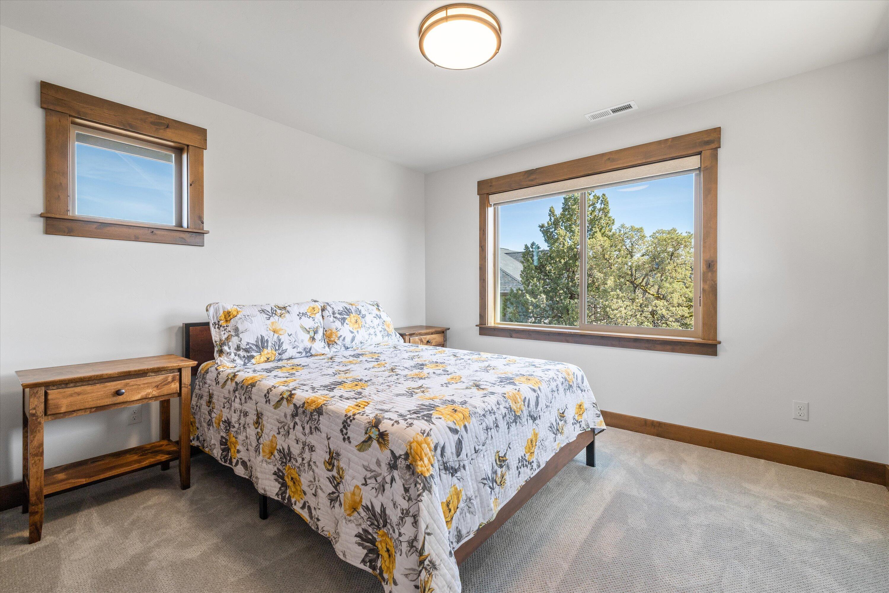 15687 Southwest Brasada Rnch Road Powell Butte, OR 97753 - Photo 46 of 73 a bedroom with a bed and a window