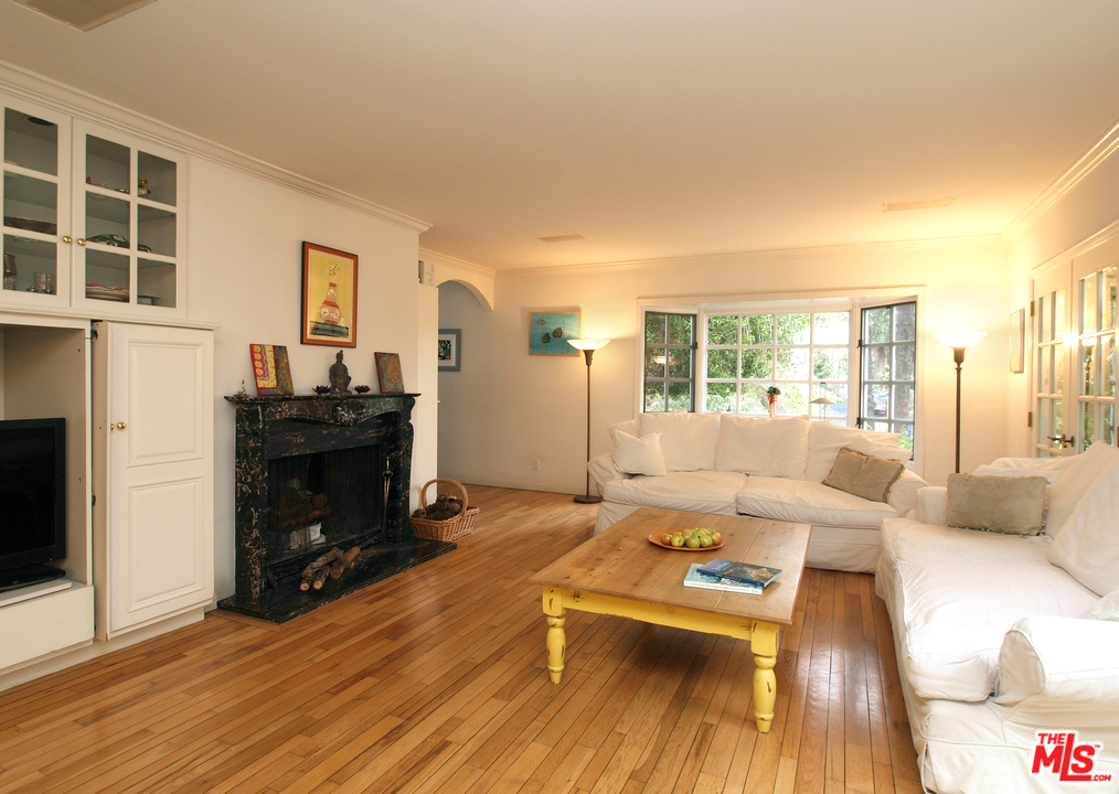 507 West Rustic Road Santa Monica, CA 90402 - Photo 2 of 32 a living room with furniture and a fireplace