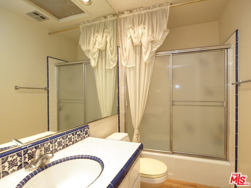 507 West Rustic Road Santa Monica, CA 90402 - Photo 14 of 32 a bathroom with a granite countertop sink toilet and shower