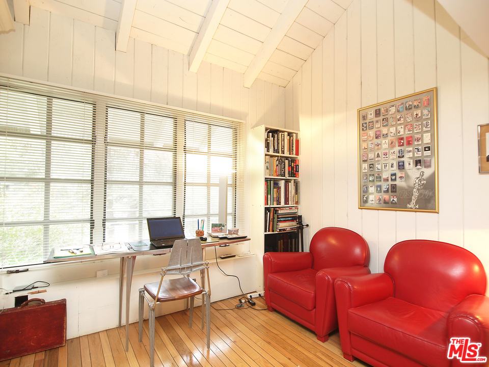 507 West Rustic Road Santa Monica, CA 90402 - Photo 17 of 32 a living room with furniture and a large window