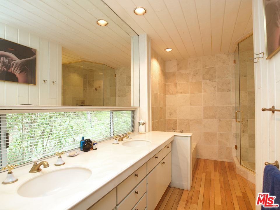507 West Rustic Road Santa Monica, CA 90402 - Photo 19 of 32 a bathroom with a sink and a mirror