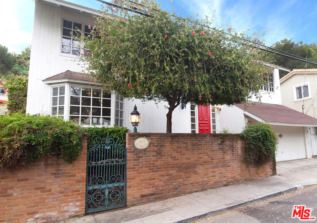 507 West Rustic Road Santa Monica, CA 90402 - Photo 32 of 32 a front view of a house with a yard