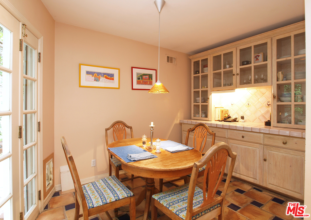 507 West Rustic Road Santa Monica, CA 90402 - Photo 7 of 32 a view of a dining room with furniture and window