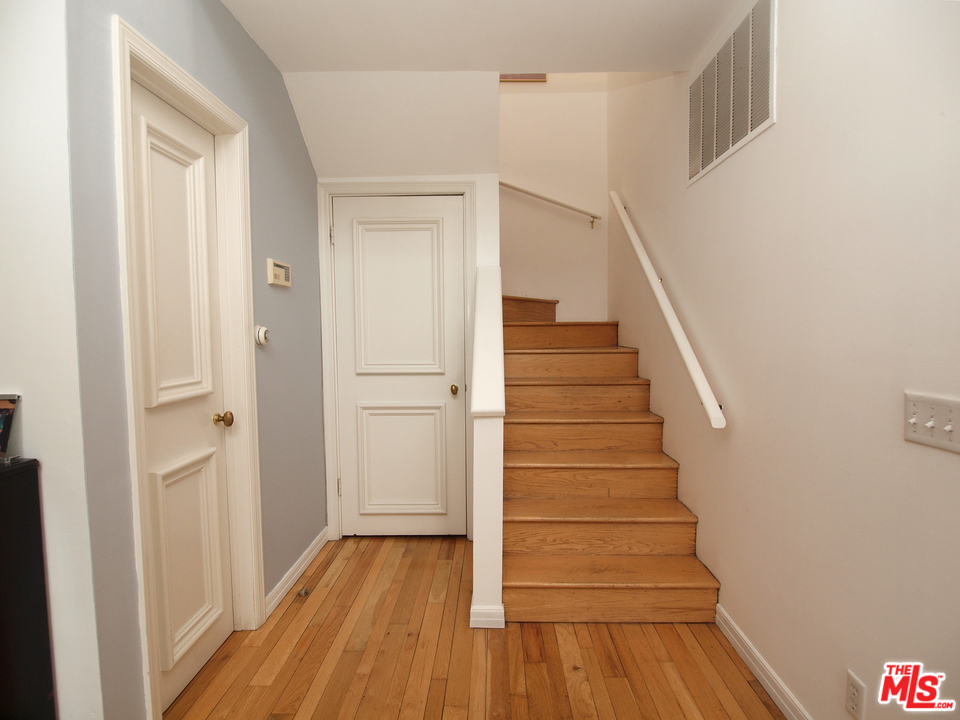 507 West Rustic Road Santa Monica, CA 90402 - Photo 9 of 32 a view of a hallway with wooden floor and entryway