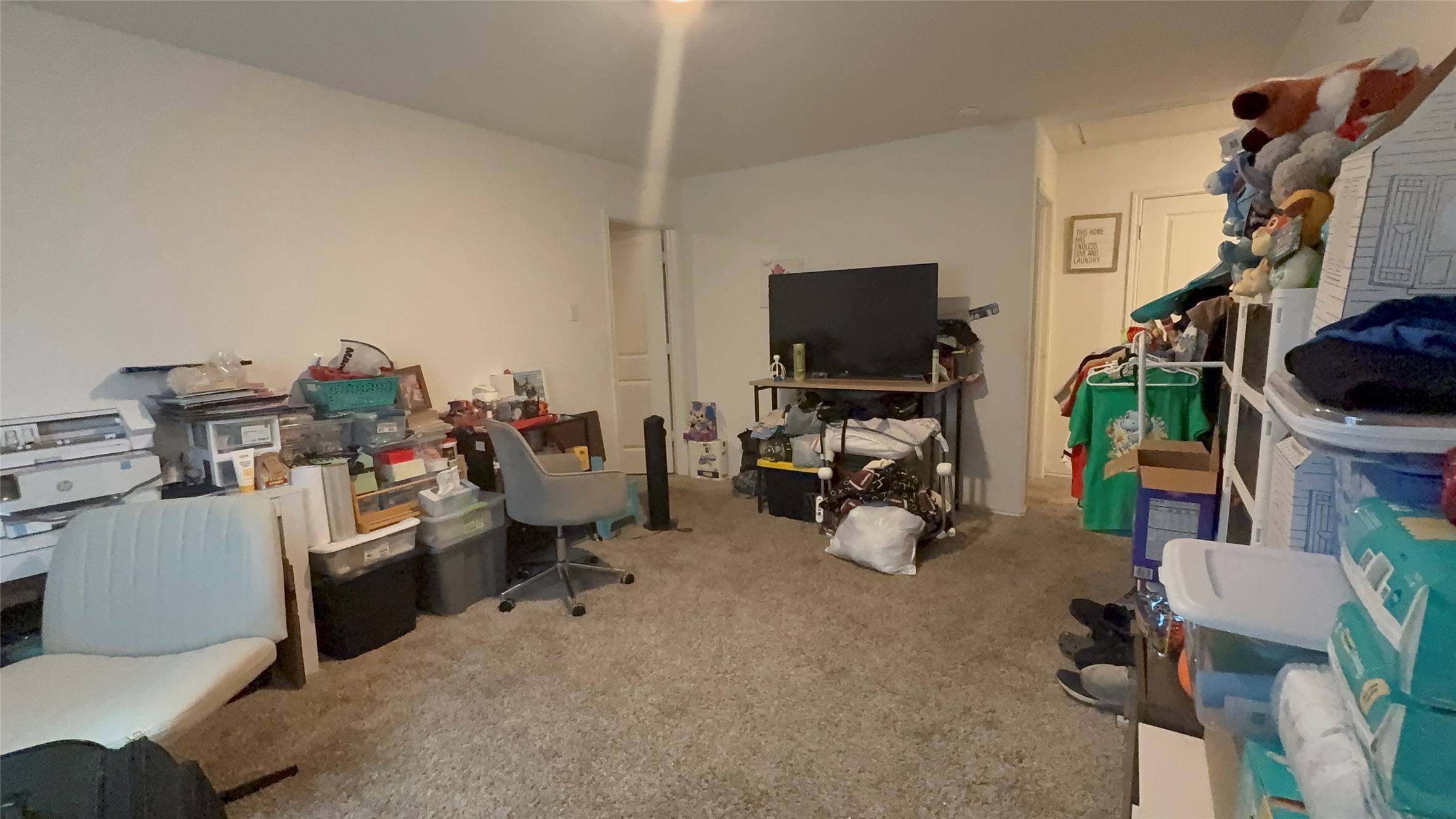 316 Geode Glen Maxwell, TX 78656 - Photo 19 of 24 a view of a workspace with furniture and a flat screen tv