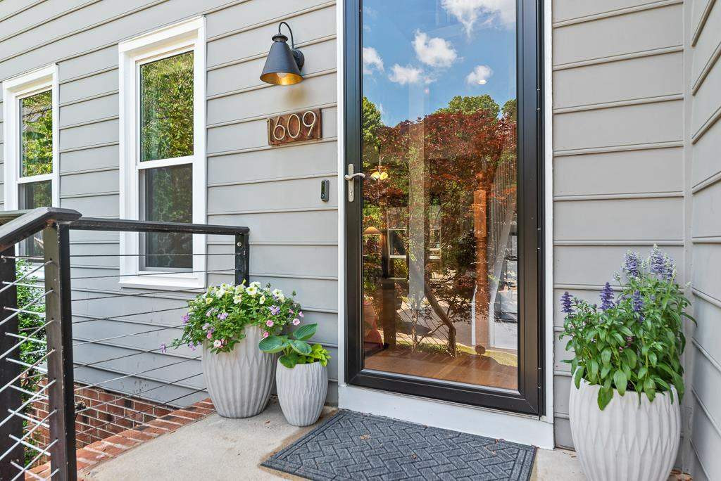 1609 Nesfield Place Raleigh, NC 27606 - Photo 2 of 30 Cable Railings, modern light fixture and house numbers provide a fresh welcome Front Stoop