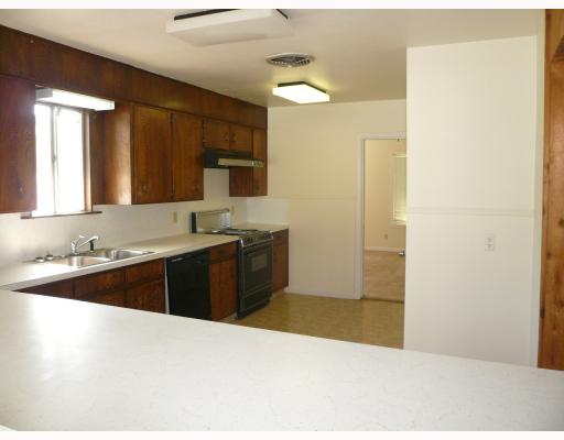 625 Chamberlain Street Corpus Christi, TX 78404 - Photo 3 of 10 a kitchen with a sink and a refrigerator