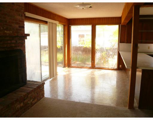 625 Chamberlain Street Corpus Christi, TX 78404 - Photo 6 of 10 a view of an empty room with wooden floor and a window