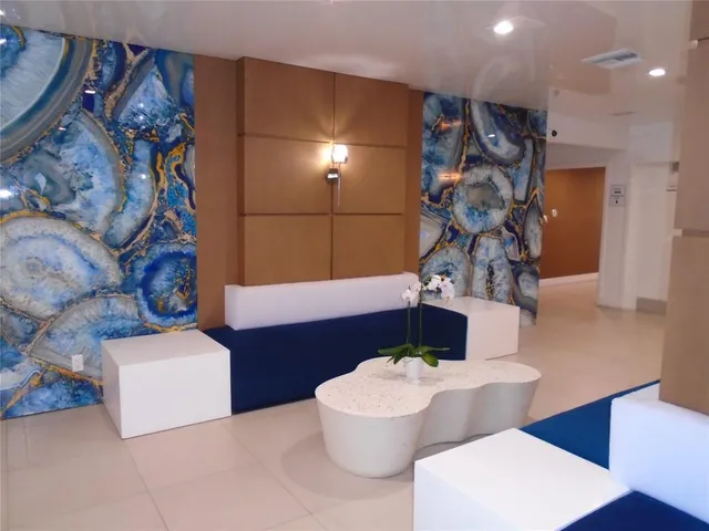 an aerial view of multiple houses with yard