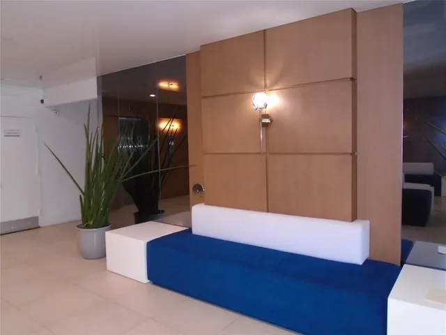 a room with a flat screen tv and painted walls