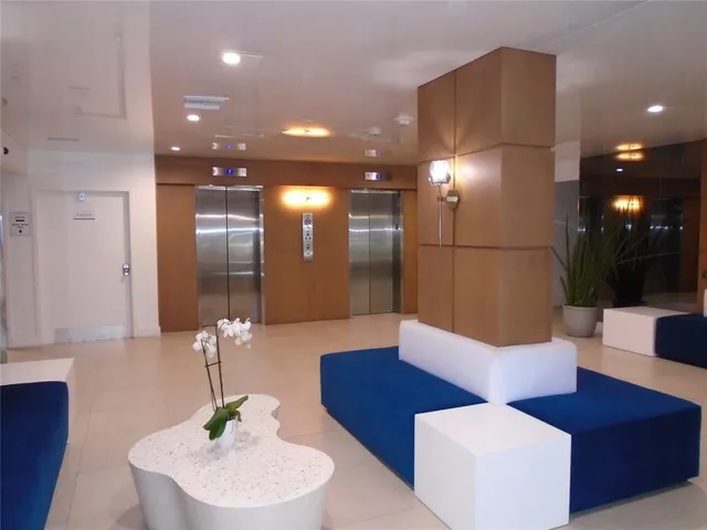 a kitchen with granite countertop white cabinets and black appliances