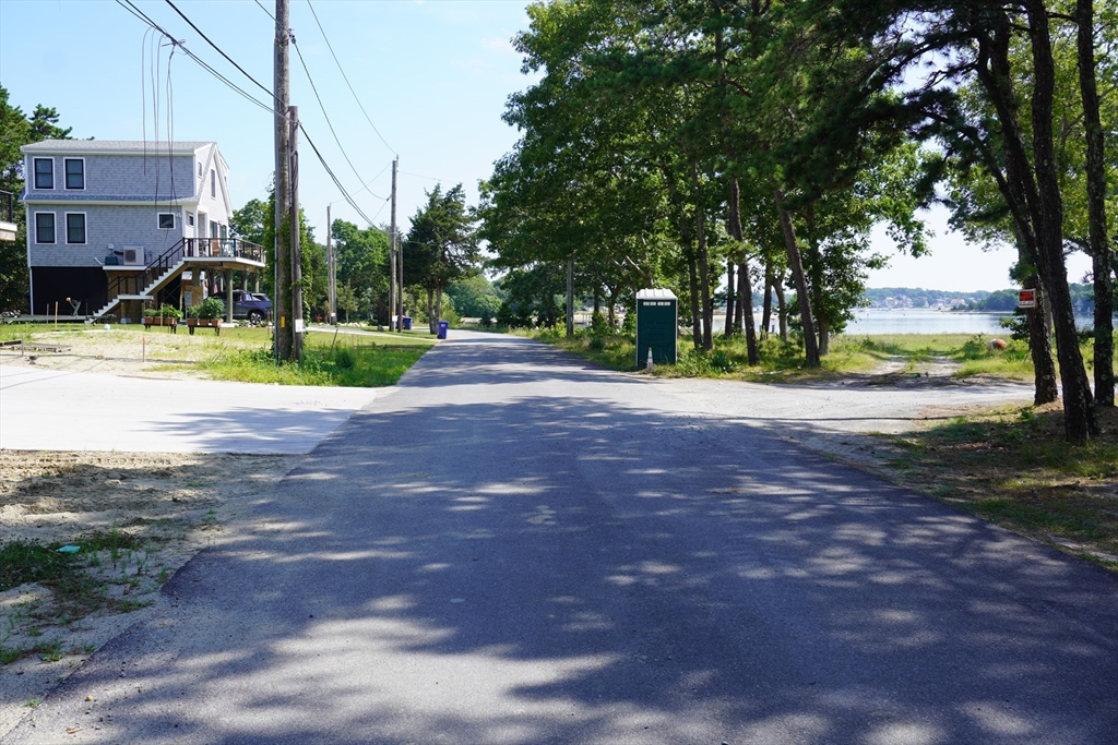10 Over Jordan Road Wareham, MA 02571 - Photo 6 of 10 a view of a house with a big yard and palm trees