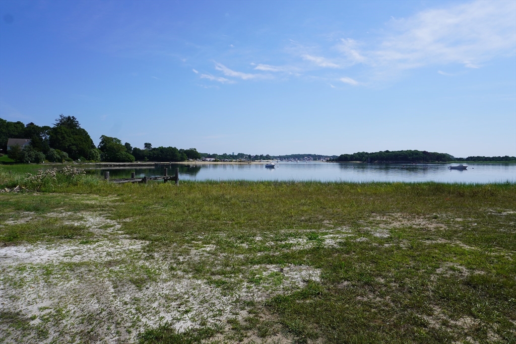 10 Over Jordan Road Wareham, MA 02571 - Photo 8 of 10 a view of a lake with houses in the back