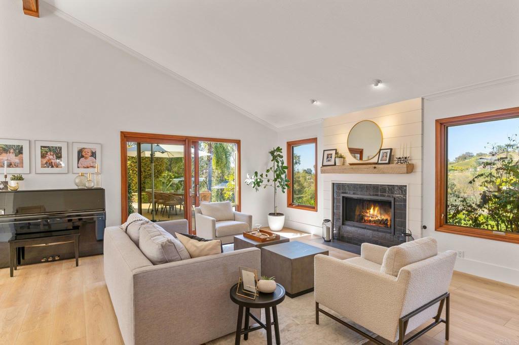 3355 Lone Jack Road Encinitas, CA 92024 - Photo 20 of 54 a living room with furniture and a fireplace