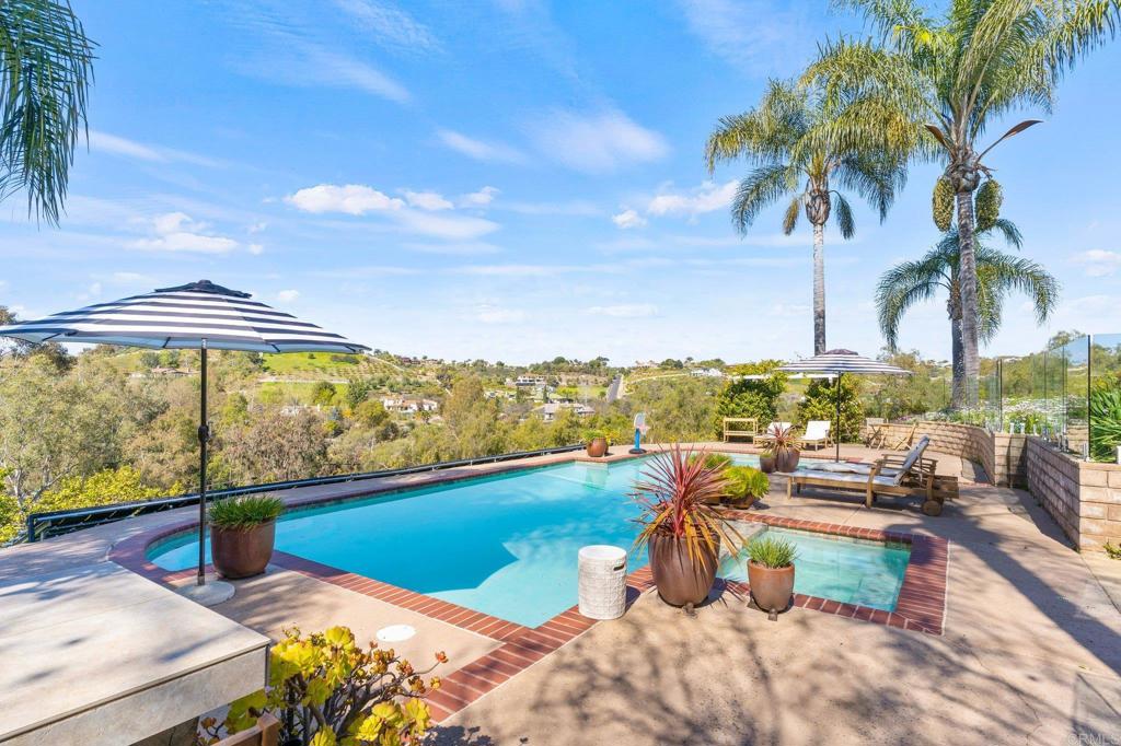 3355 Lone Jack Road Encinitas, CA 92024 - Photo 2 of 54 a view of a swimming pool with a patio