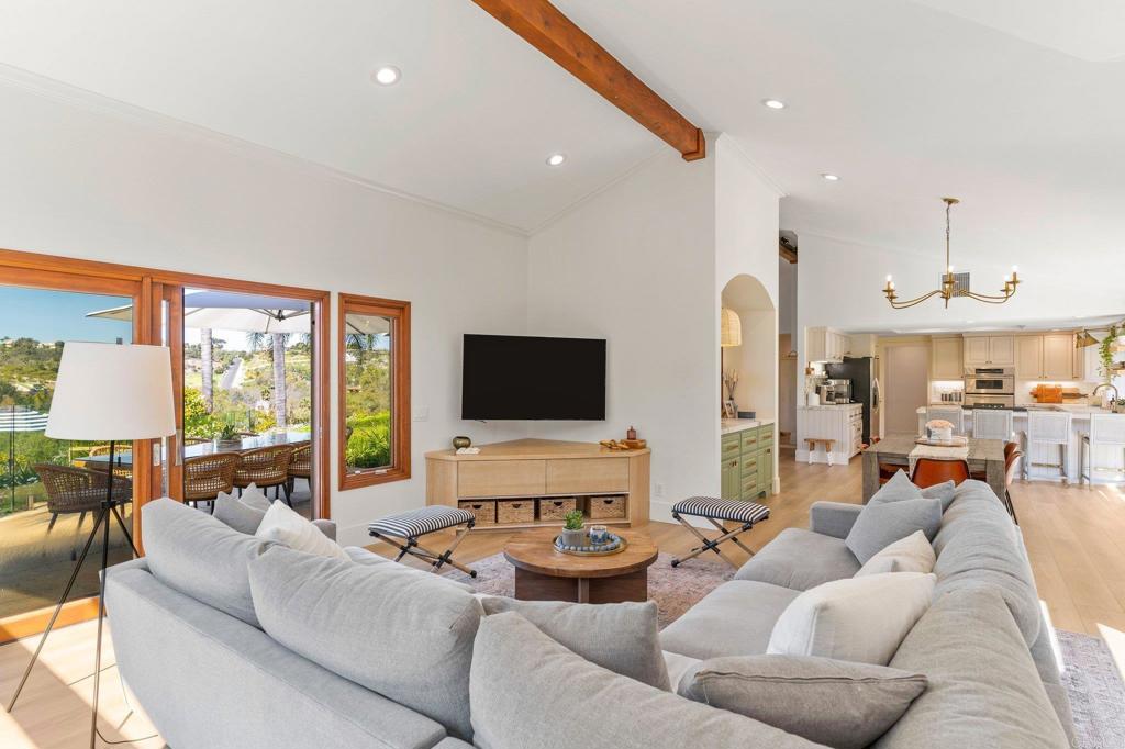 3355 Lone Jack Road Encinitas, CA 92024 - Photo 25 of 54 a living room with furniture and a flat screen tv