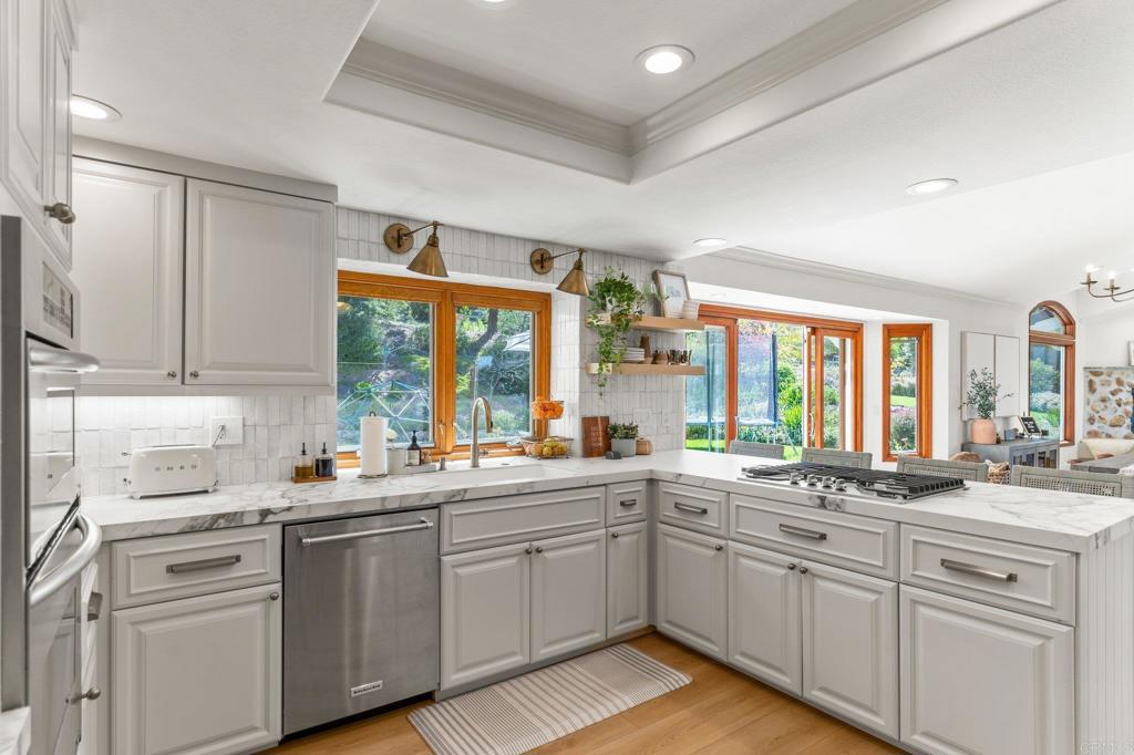 3355 Lone Jack Road Encinitas, CA 92024 - Photo 28 of 54 a kitchen with sink a window and cabinets