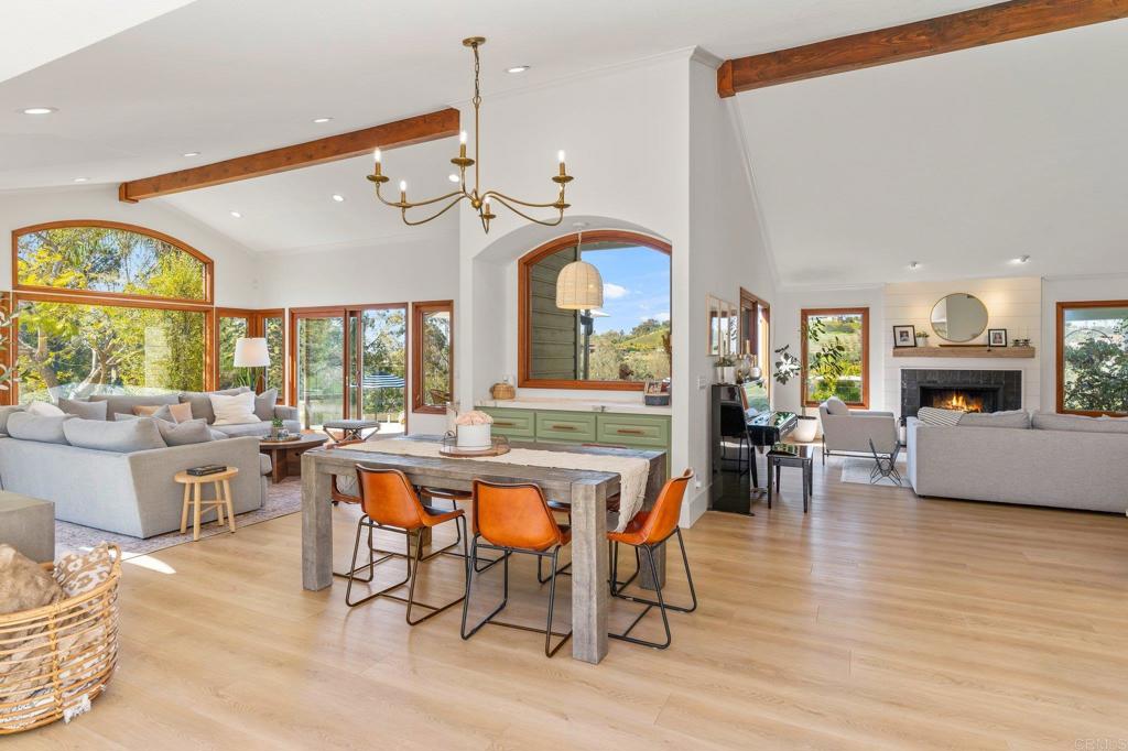 3355 Lone Jack Road Encinitas, CA 92024 - Photo 31 of 54 a view of a dining room with furniture window and wooden floor