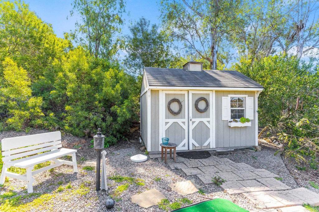 3355 Lone Jack Road Encinitas, CA 92024 - Photo 38 of 54 a house with trees in the background