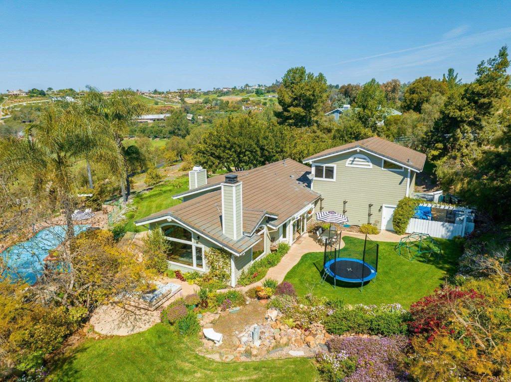 3355 Lone Jack Road Encinitas, CA 92024 - Photo 42 of 54 an aerial view of a house with swimming pool and garden view