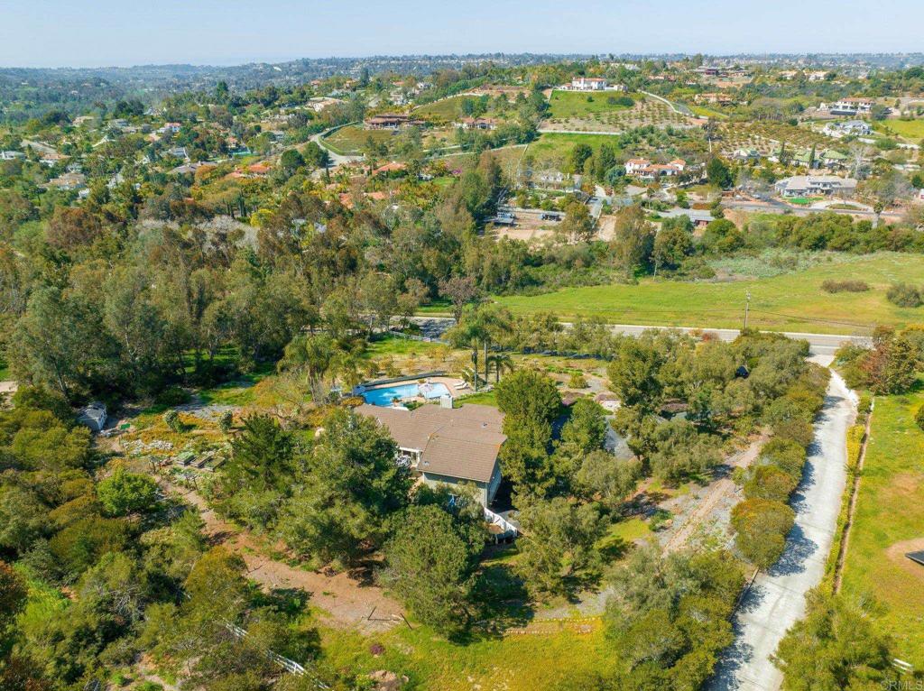 3355 Lone Jack Road Encinitas, CA 92024 - Photo 47 of 54 an aerial view of residential houses with outdoor space and trees