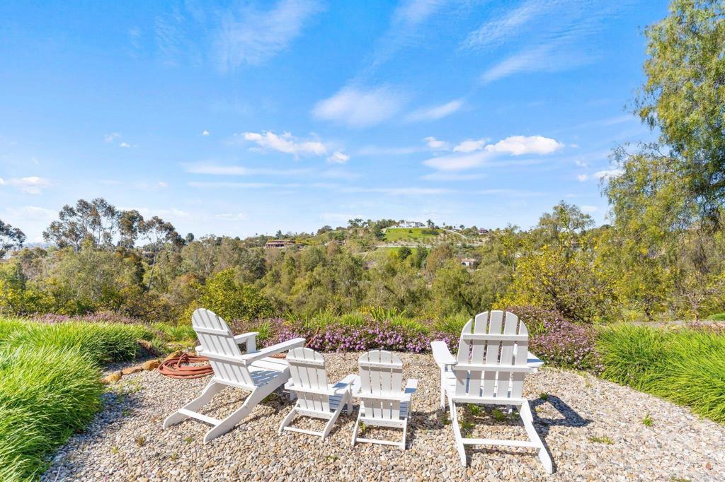 3355 Lone Jack Road Encinitas, CA 92024 - Photo 8 of 54 a view of a chairs and table in a yard